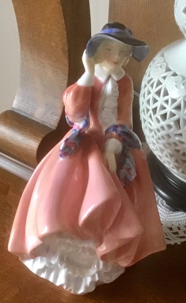 This image has an empty alt attribute; its file name is Royal-Doulton-Figurine-629x1024.jpg